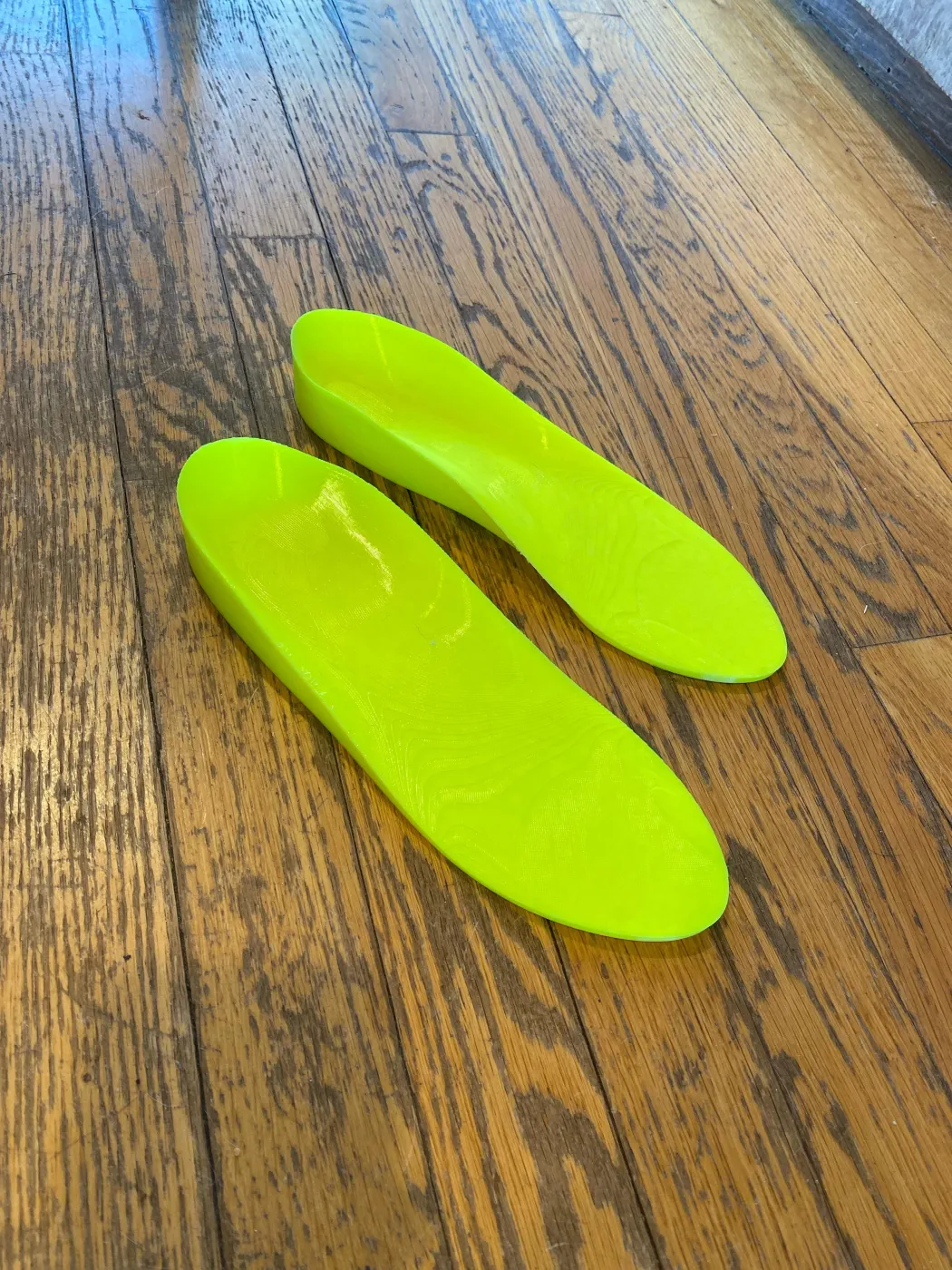 A pair of custom TPU insoles printed by an Ergono3D user